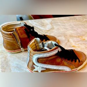 Golden Goose mid-top sneakers in ​worn leather with dyed calf hair star.